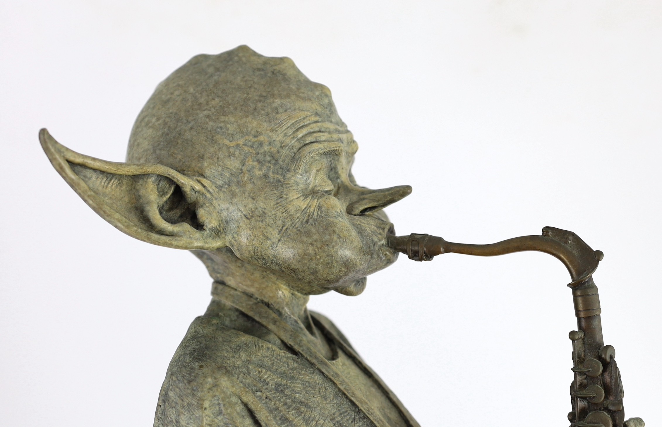 David Goode (British, b.1966). A bronze of a pixie saxophone player, height 61cm